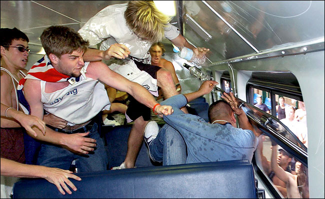 The crowd on a train target people of Arabic and Mediterranean appearance, blamed for attacks on two lifeguards a week ago, Sydney, December 12, 2005.